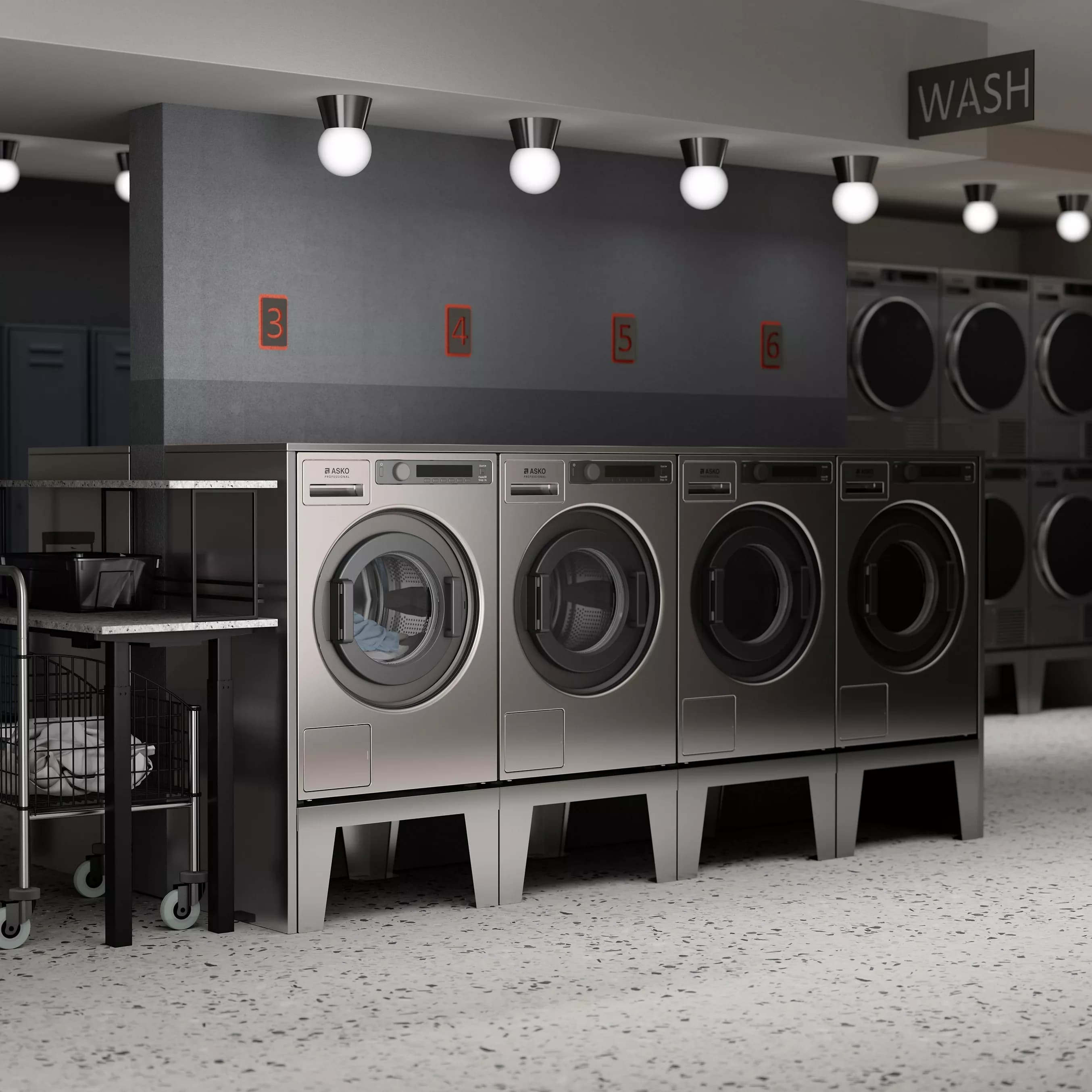 Lave-linge professionnel installé pour un usage collectif intensif